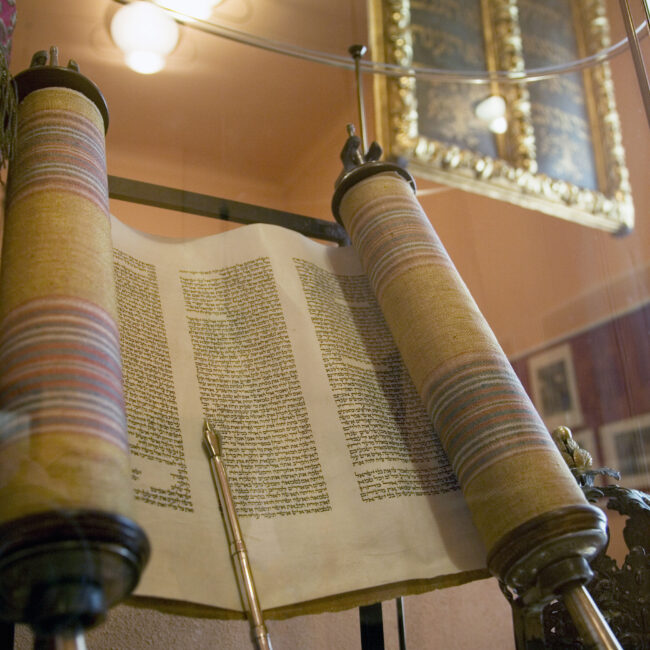 Antique Torah scroll on display